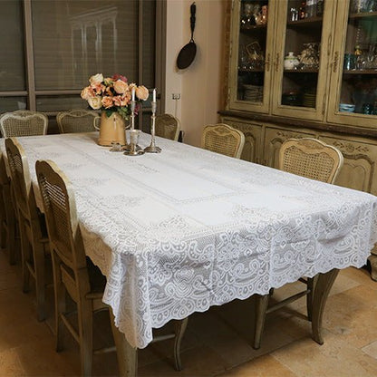 Elegant Tablecloth white lace tablecloth draped over dining table for Shabbat and Yom Tov celebrations